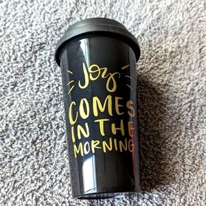 The Created Co. black reusable cup with gold writing "Joy Comes In The Morning"
